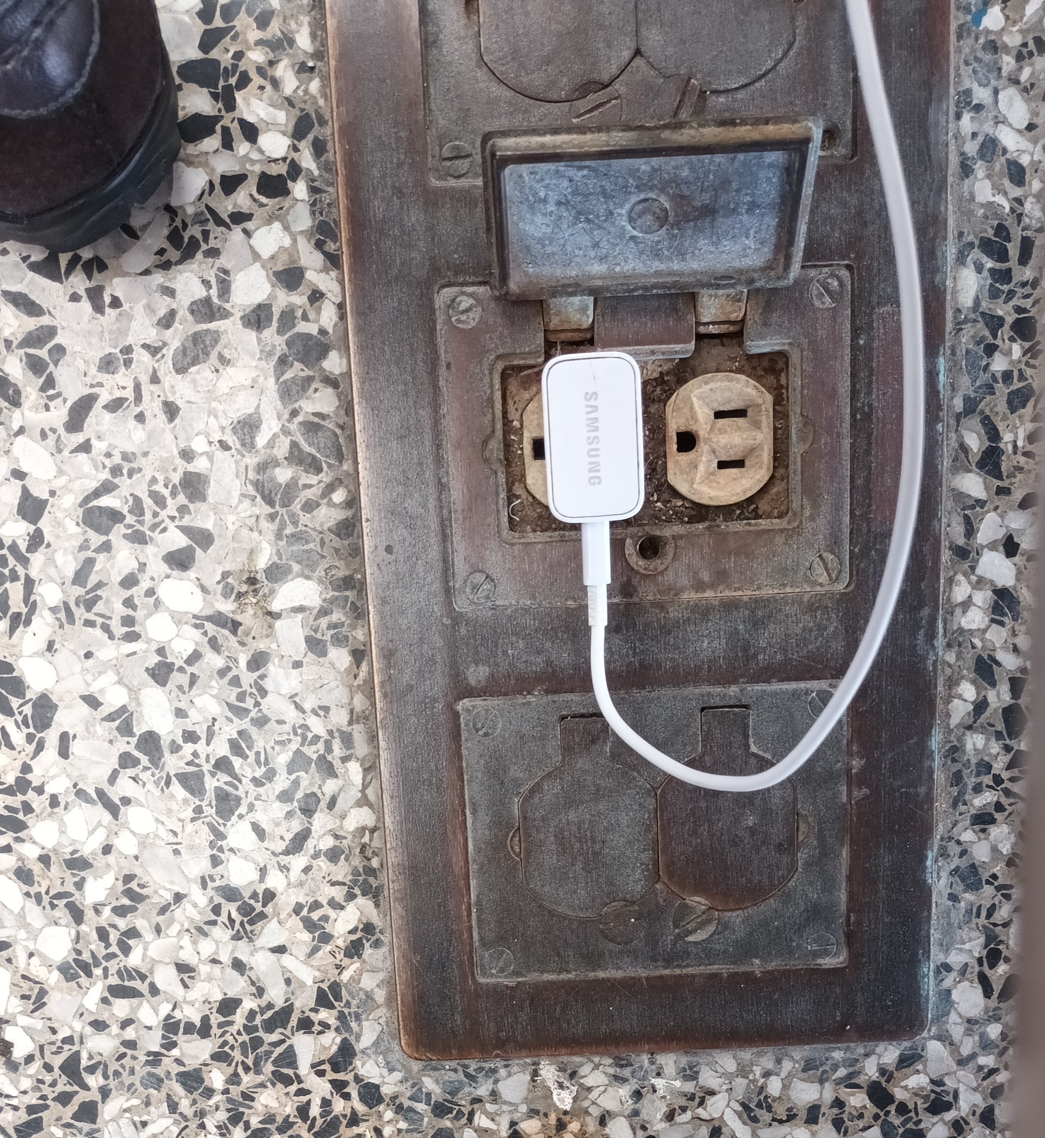 A plug with a phone charger cable